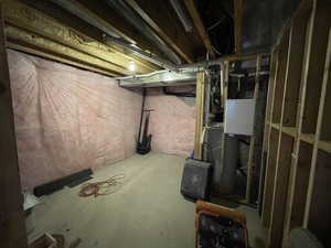 Unfinished basement with heating unit