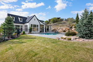 Rear view of property with a patio and stucco siding