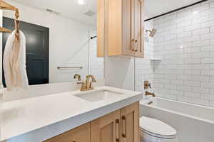 Full bath with vanity and bathing tub / shower combination