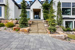 View of exterior entry with brick siding