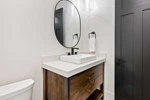 Bathroom featuring toilet and vanity