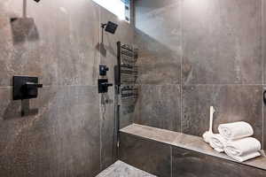 Full bath with a tile shower