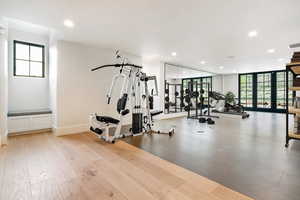 Exercise room featuring expansive windows and recessed lighting