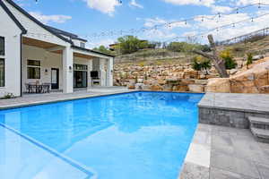 Outdoor pool with a patio