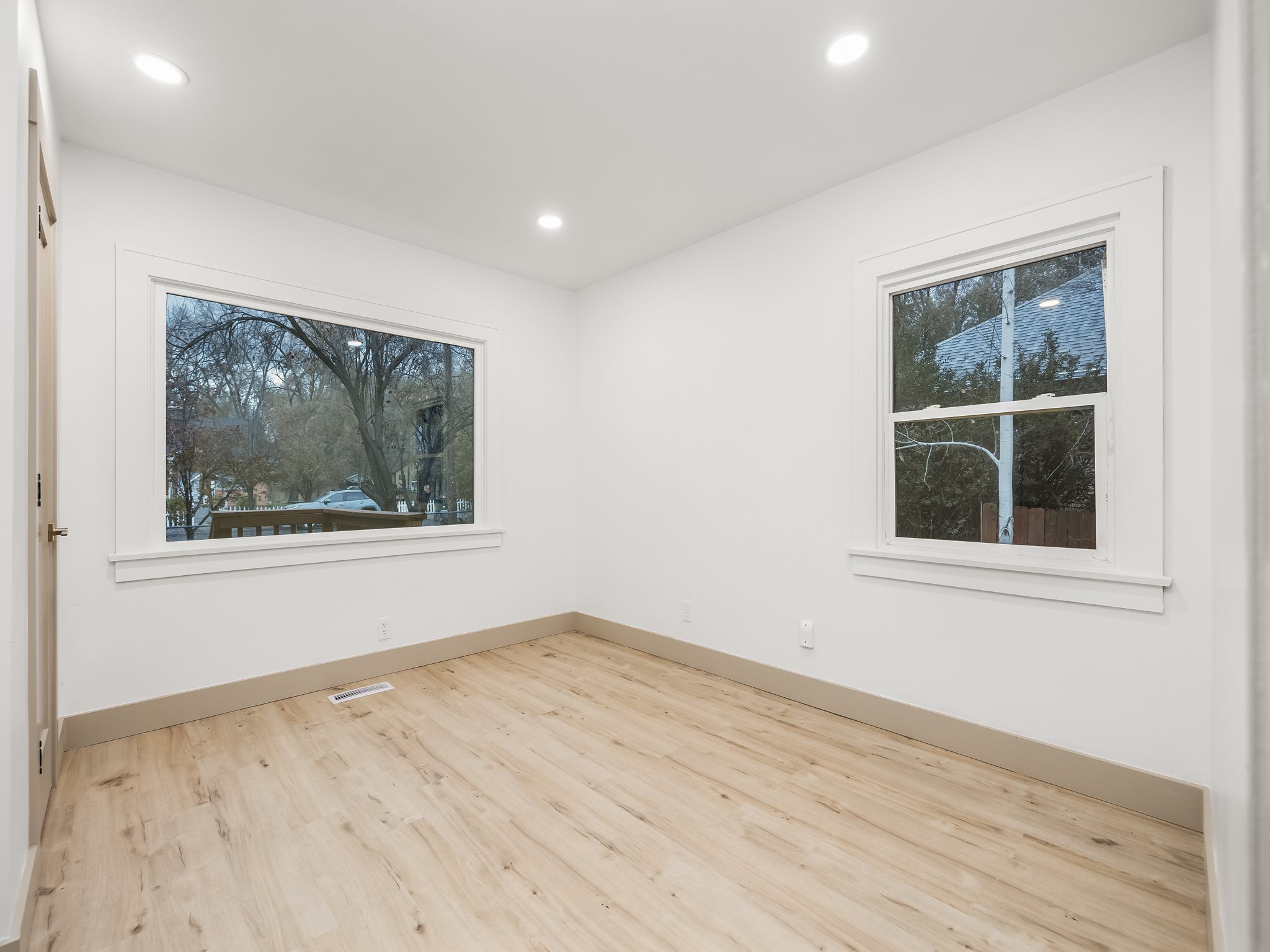 Unfurnished room with light wood-style flooring, recessed lighting, and healthy amount of natural light