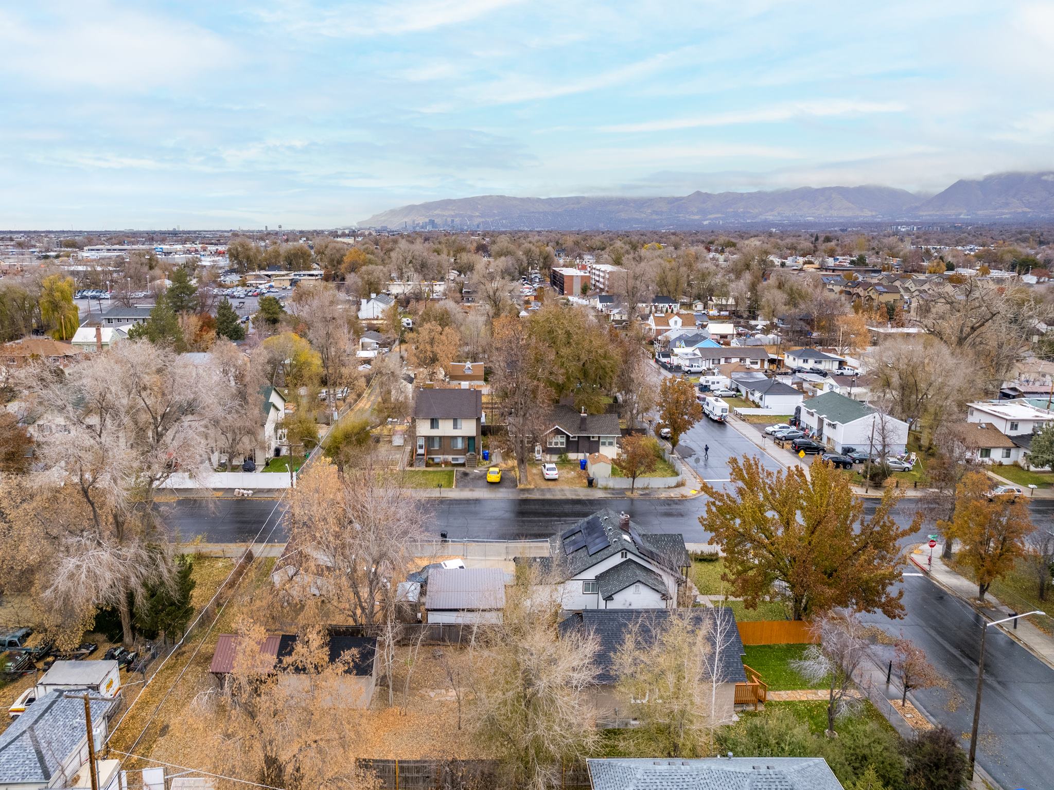 Aerial perspective of suburban area with a mountain backdrop