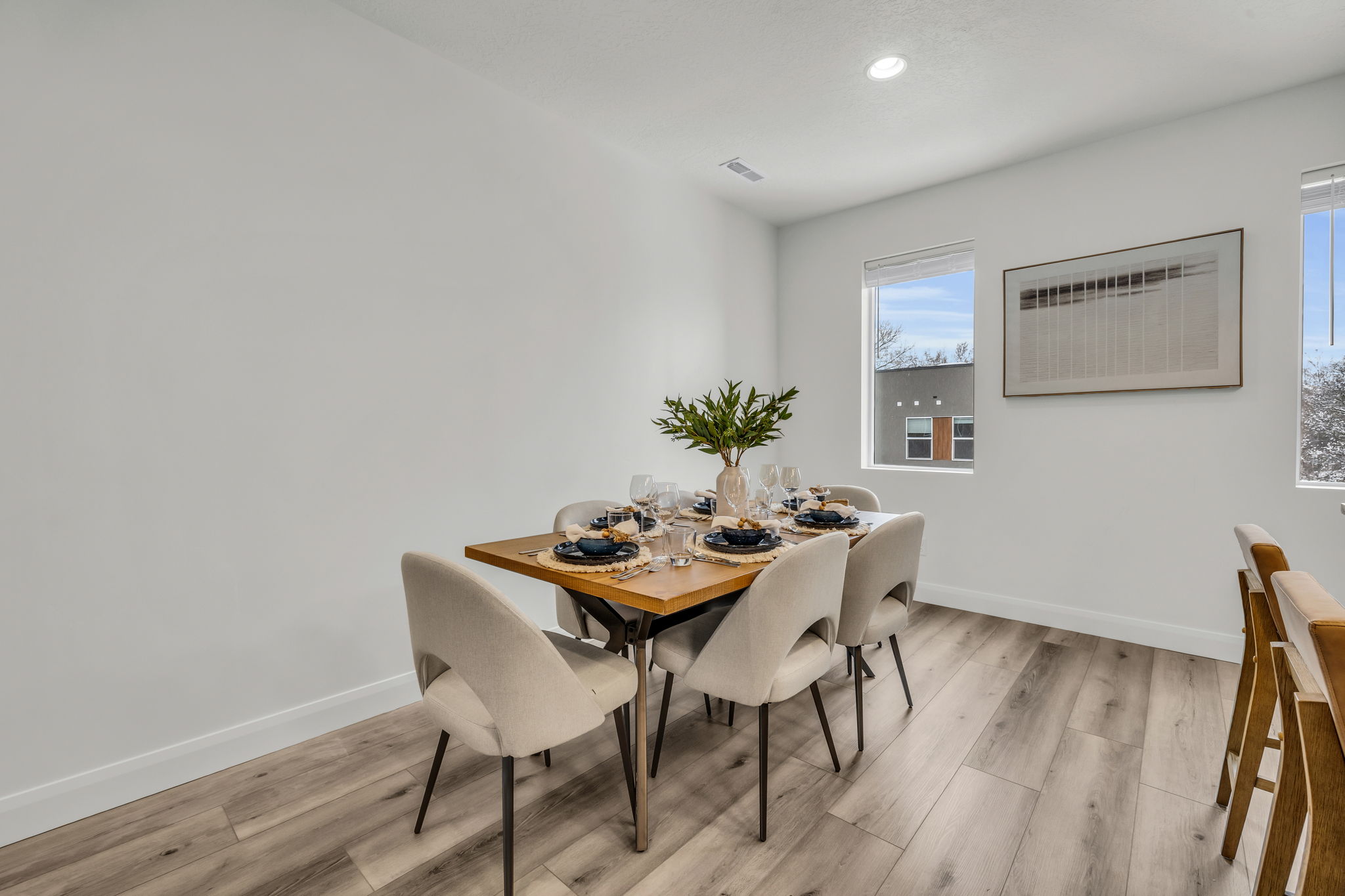 Dining space featuring light wood-style flooring and recessed lighting