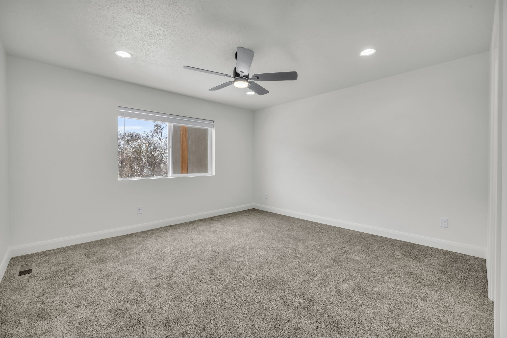Empty room with carpet flooring, recessed lighting, and a ceiling fan
