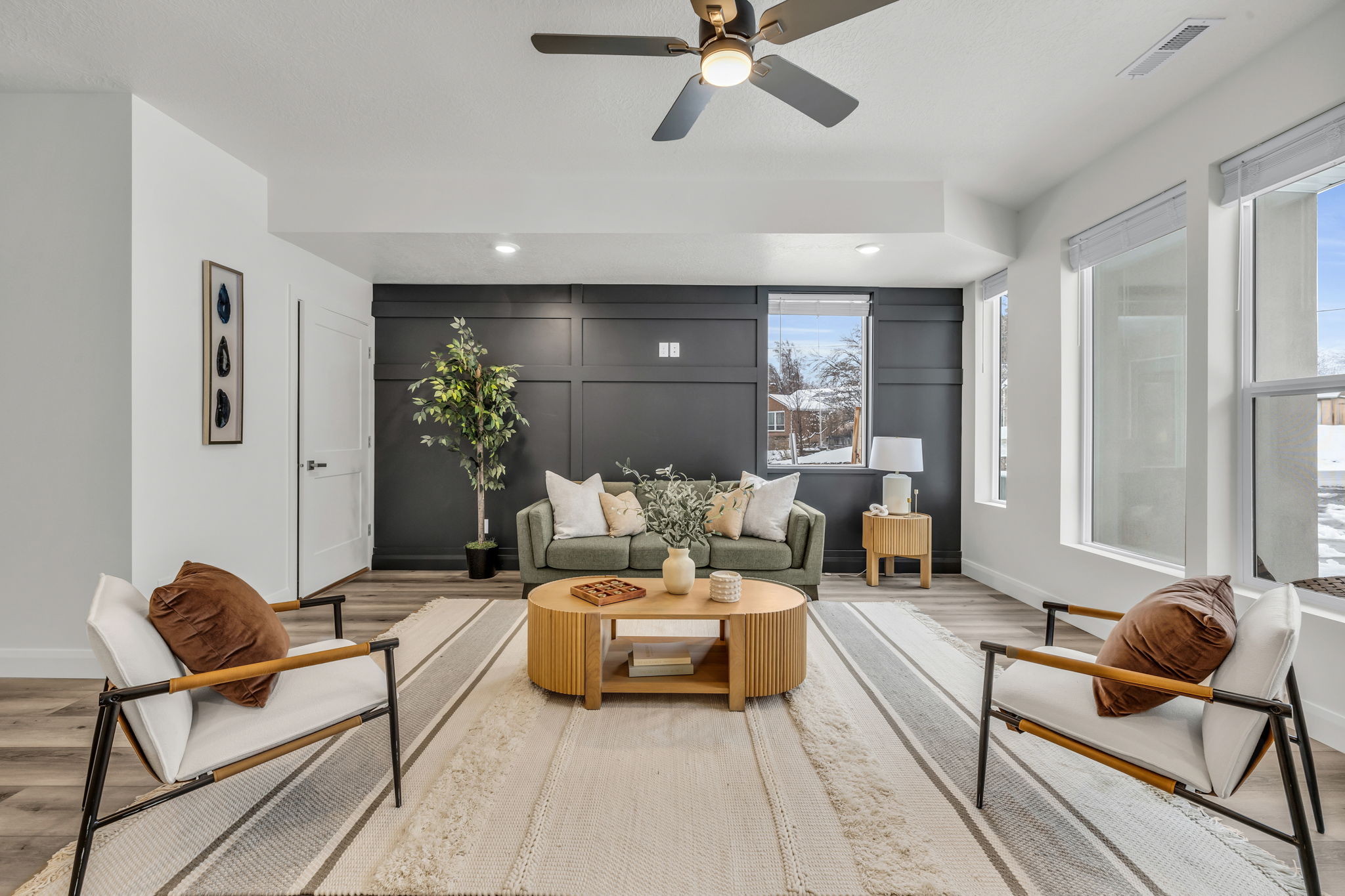 Living room featuring a ceiling fan, recessed lighting, and wood finished floors
