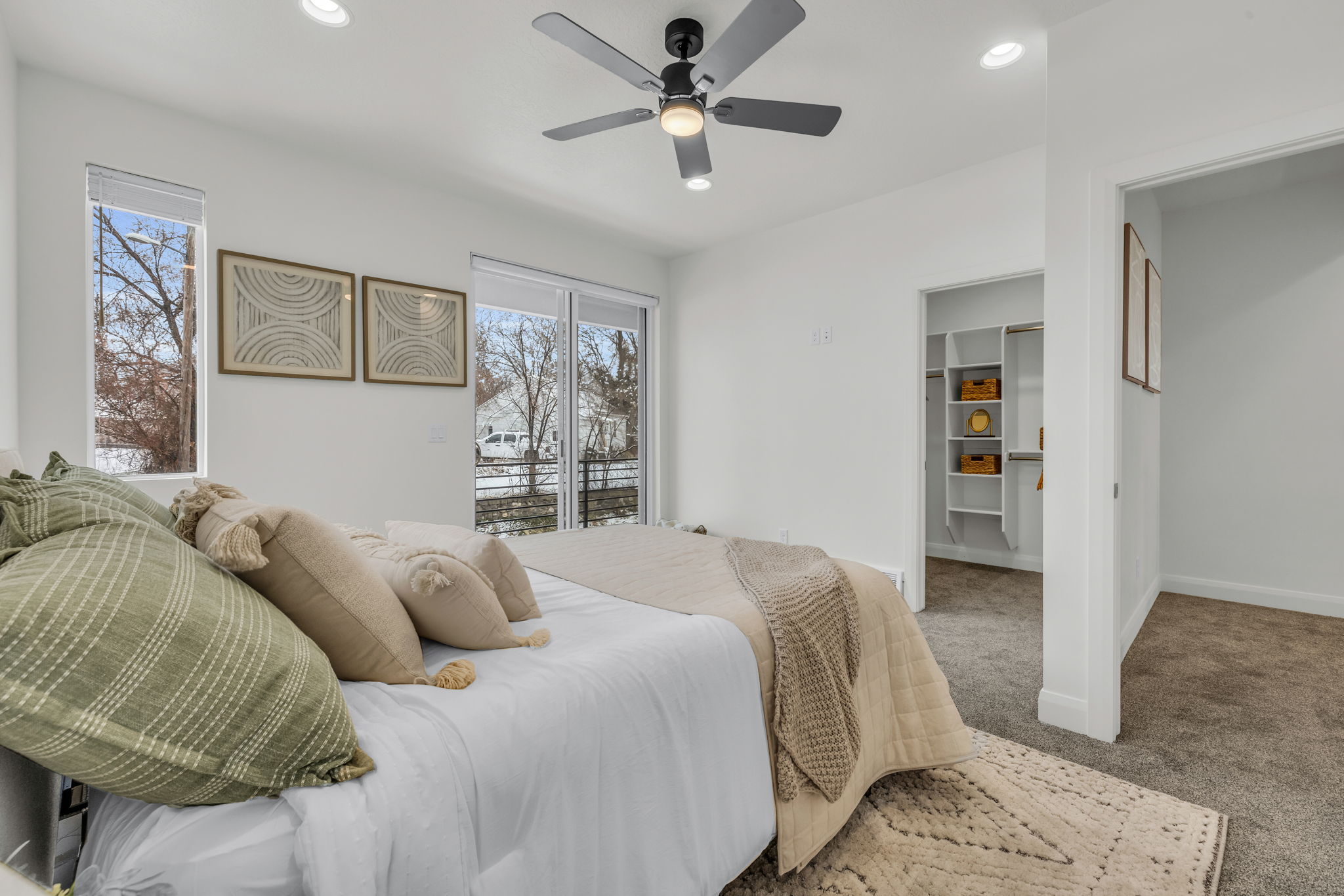 Bedroom with carpet, recessed lighting, ceiling fan, access to exterior, and a walk in closet