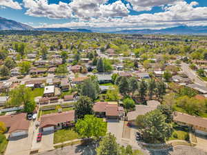 Aerial view of residential area featuring a mountain backdrop