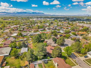 Aerial view of residential area featuring a mountainous background