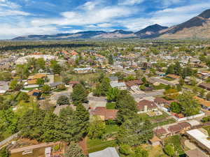 Aerial perspective of suburban area with a mountain backdrop