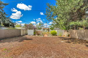 View of fenced backyard