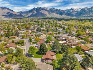 Aerial perspective of suburban area with a mountain backdrop