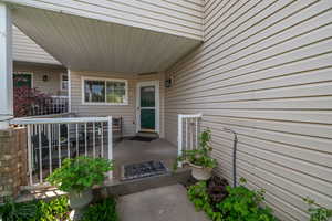 Doorway to property featuring a patio