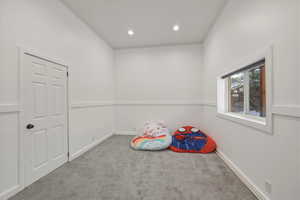 Recreation room featuring carpet and recessed lighting