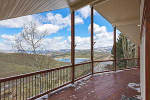 Wooden terrace with a water and mountain view