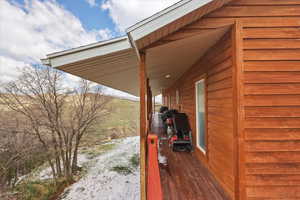 Deck featuring an attached carport