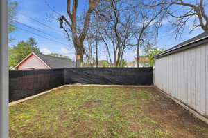 View of fenced backyard