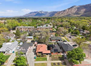 Aerial perspective of suburban area featuring a mountainous background