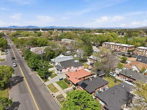 Aerial perspective of suburban area with a mountain backdrop