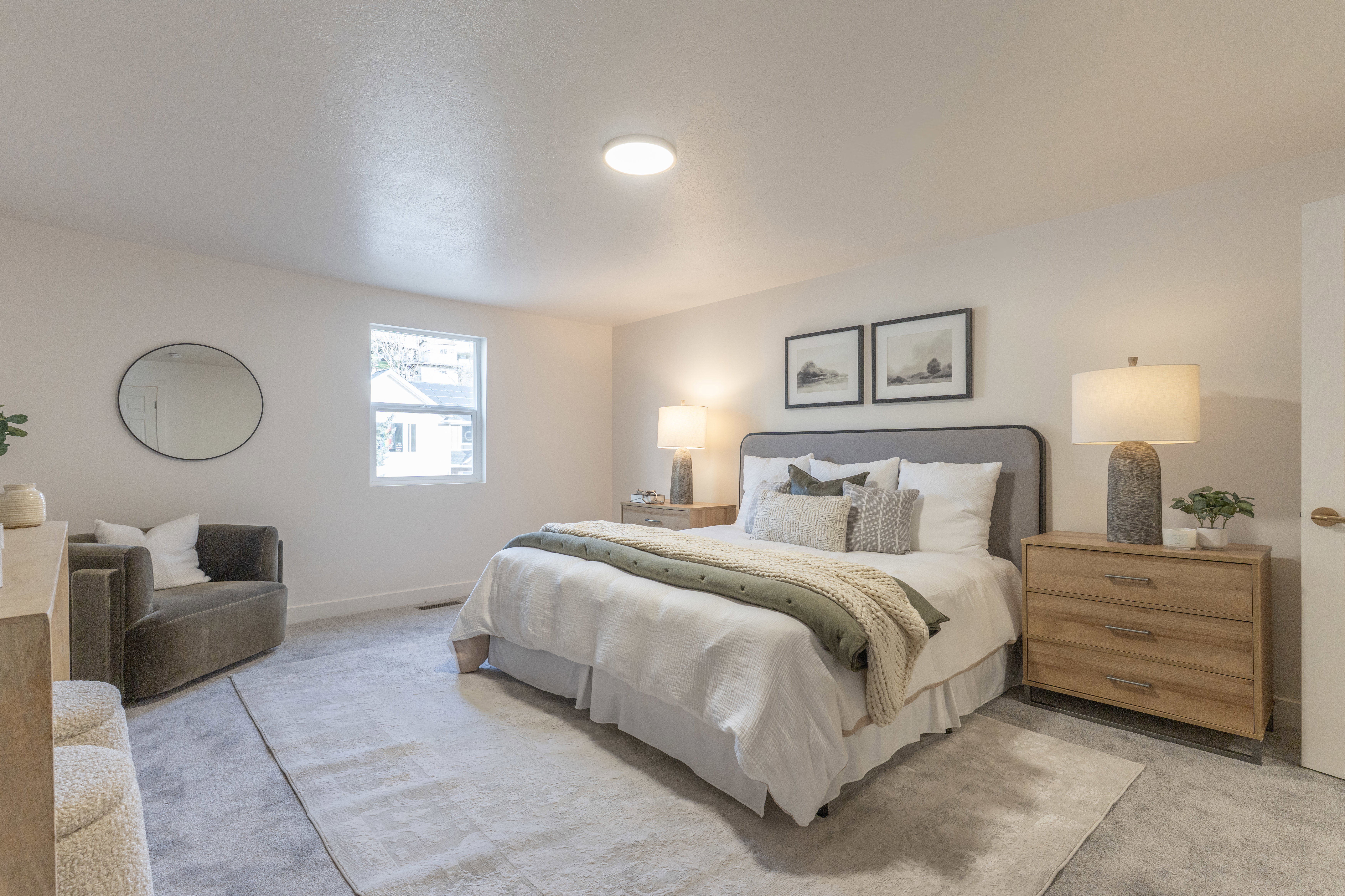 Bedroom featuring light colored carpet and baseboards