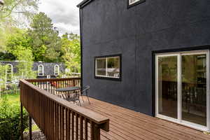 Wooden deck featuring outdoor dining space