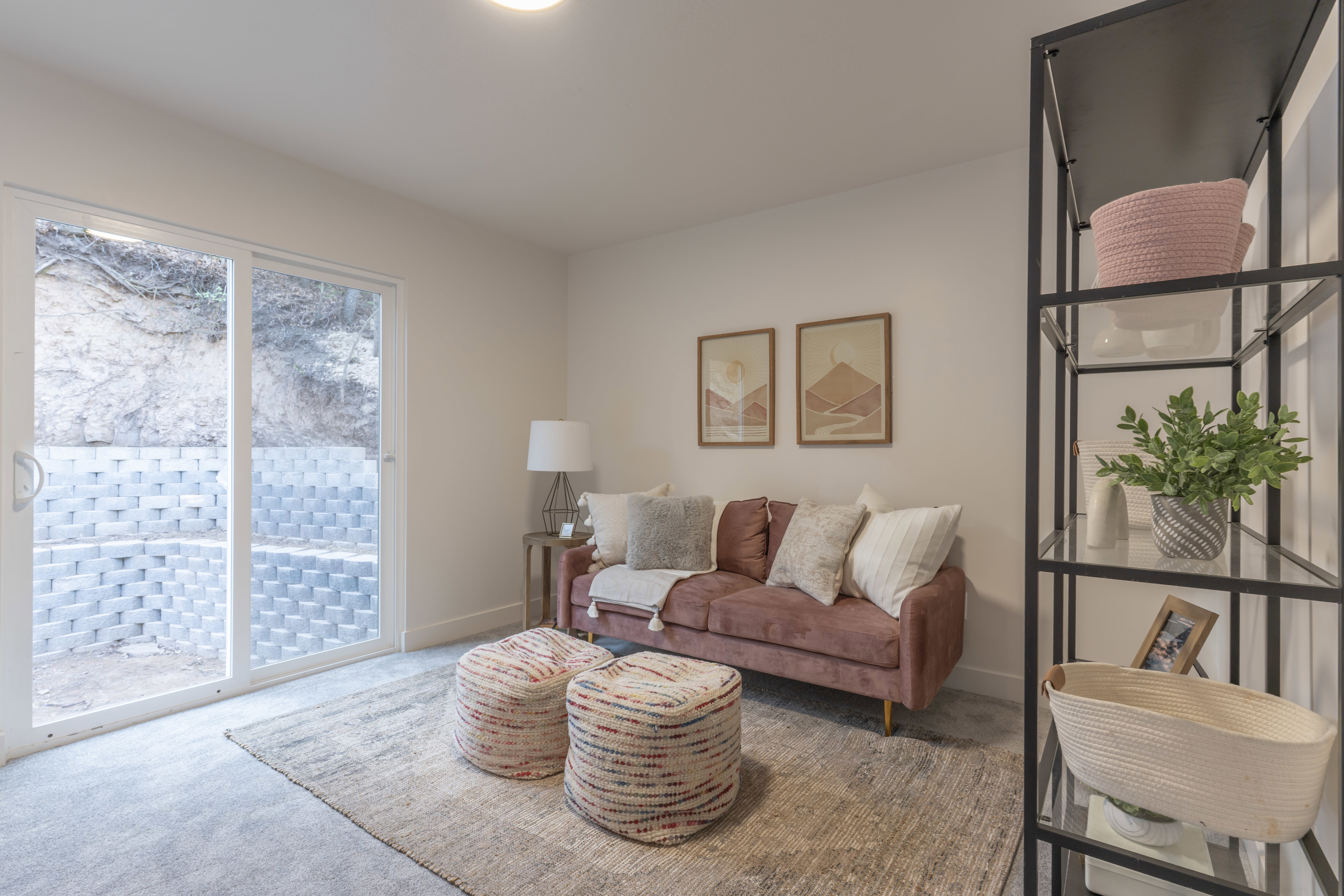 Carpeted living area with baseboards