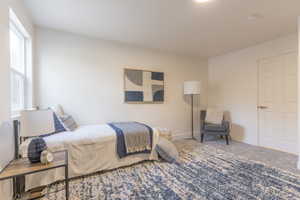 Carpeted bedroom with baseboards
