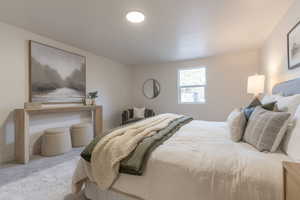 Bedroom with carpet flooring and baseboards