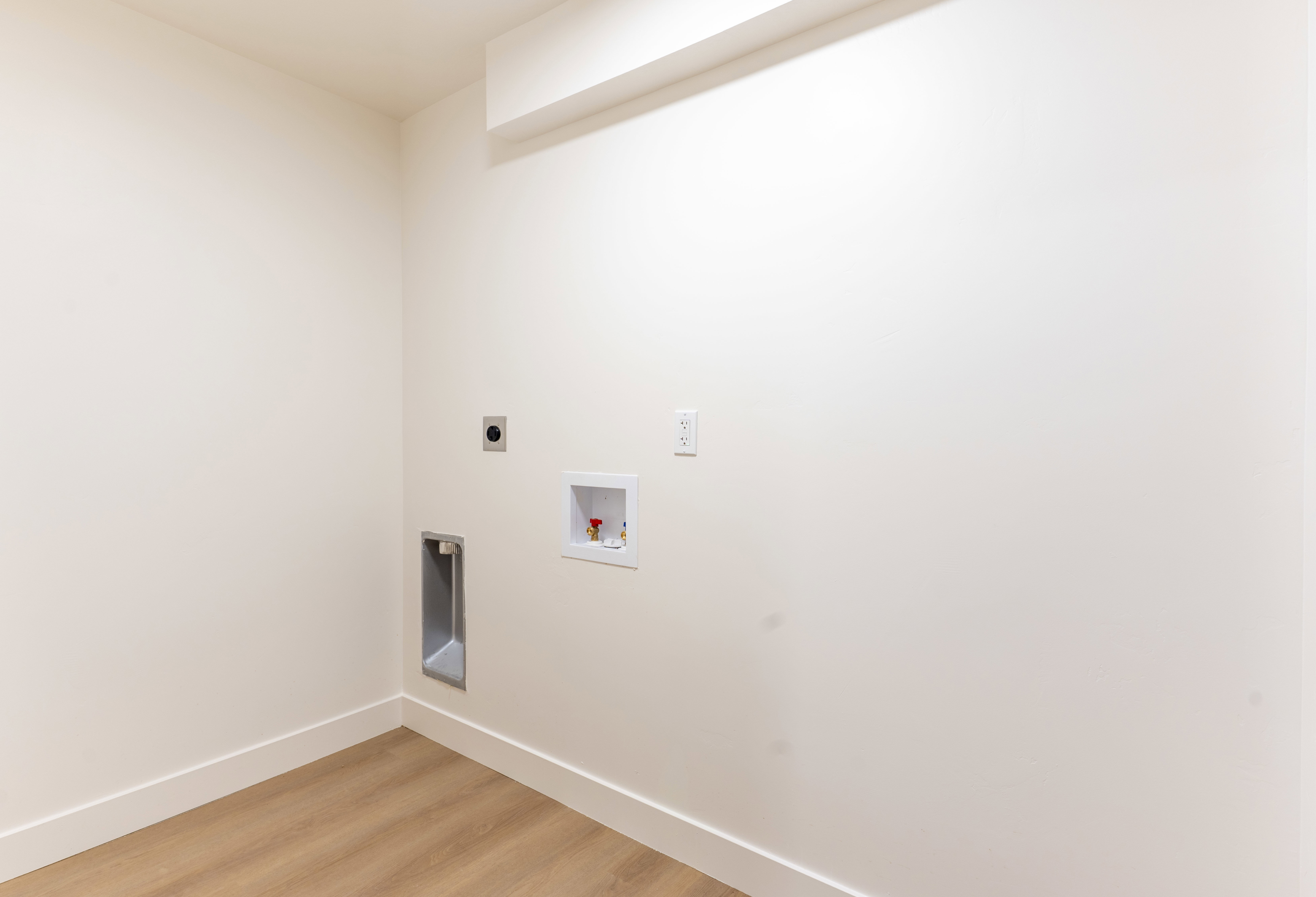 Laundry room with light wood-style flooring, electric dryer hookup, and hookup for a washing machine