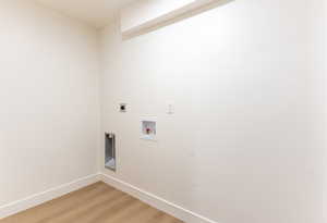 Laundry room with light wood-style flooring, electric dryer hookup, and hookup for a washing machine