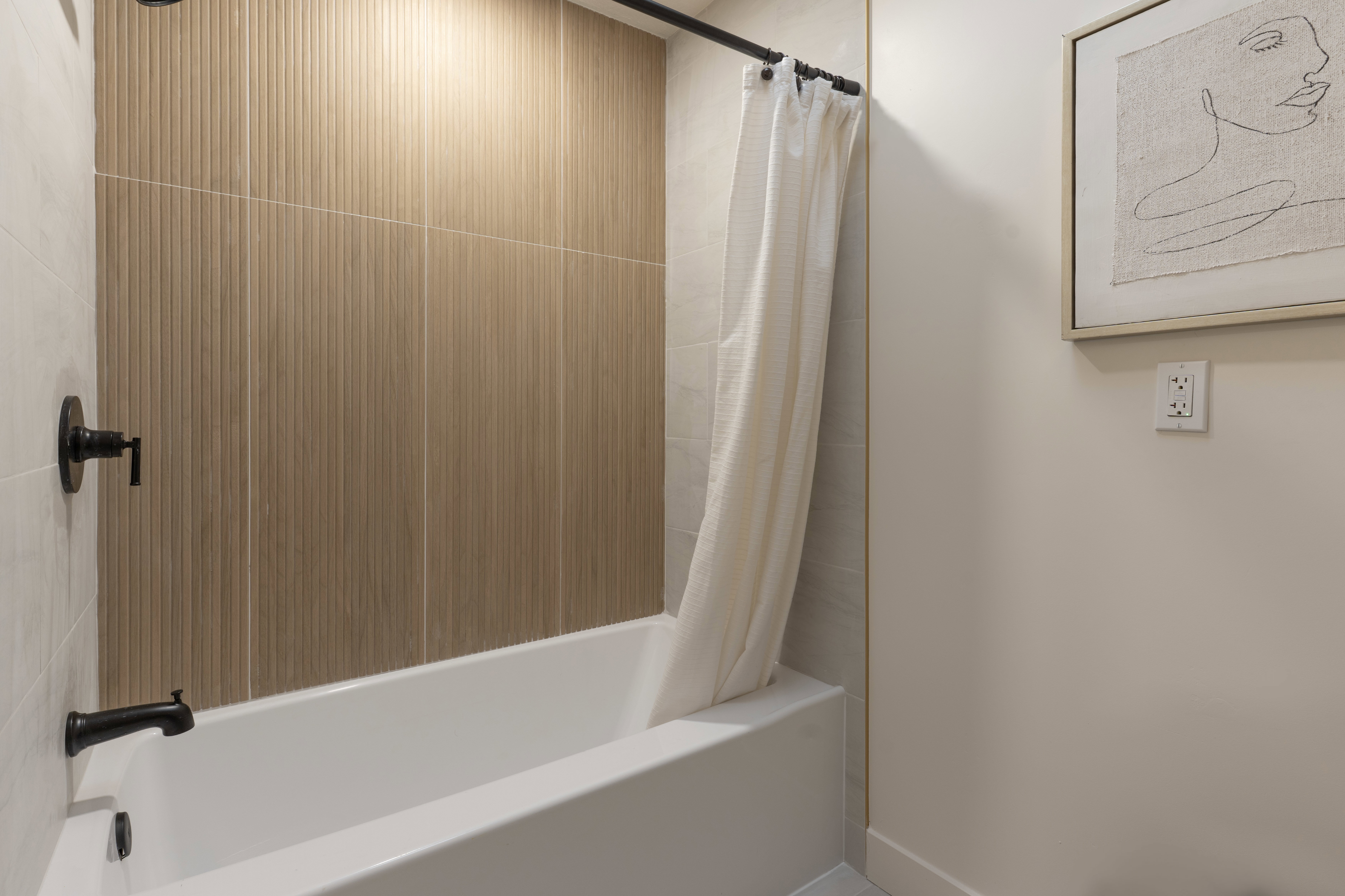 Bathroom featuring shower / bath combination with curtain