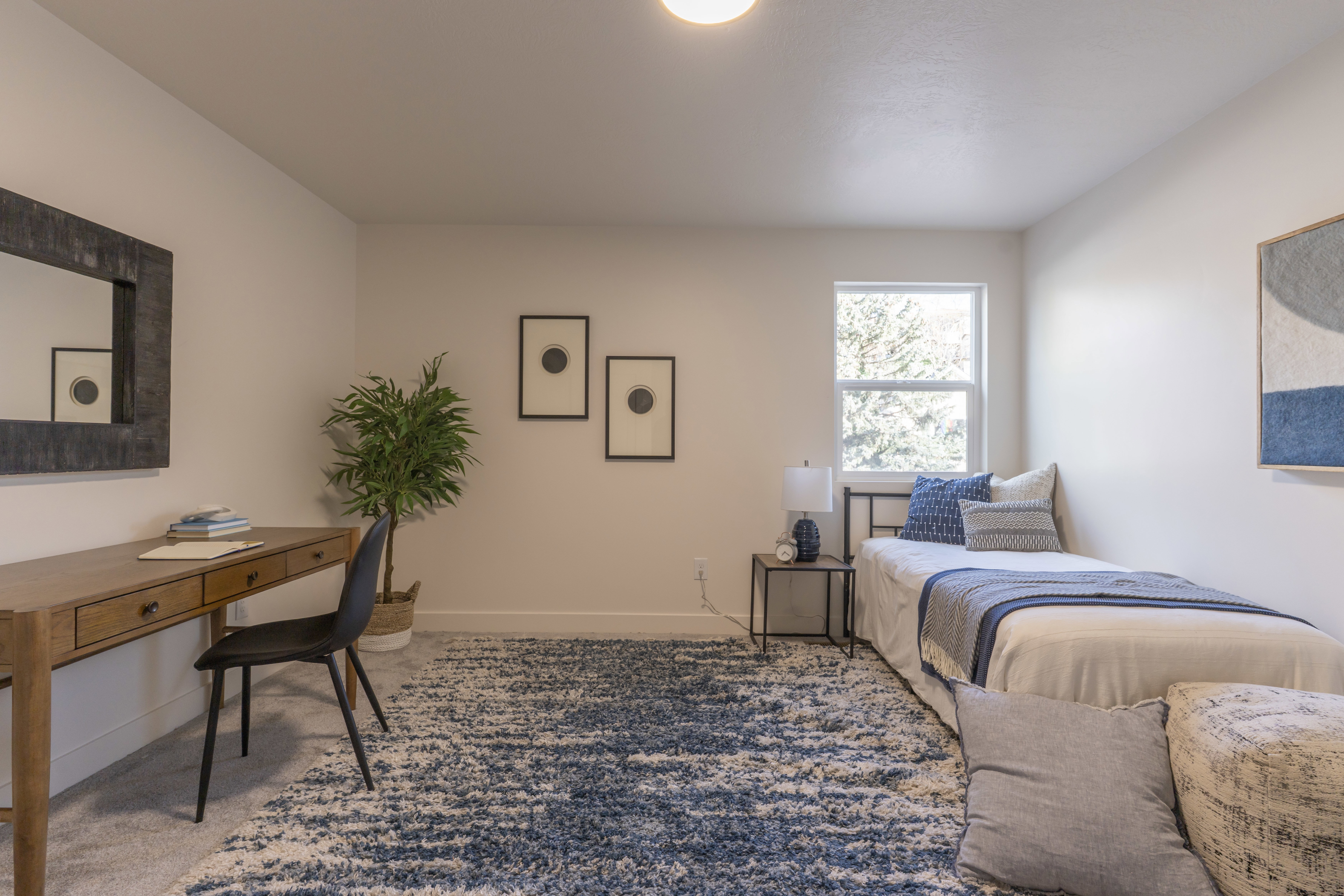 Bedroom featuring baseboards and carpet flooring