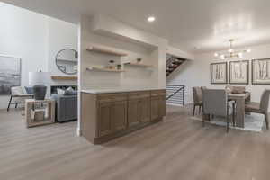 Dining room featuring suspended lighting and light wood-style flooring