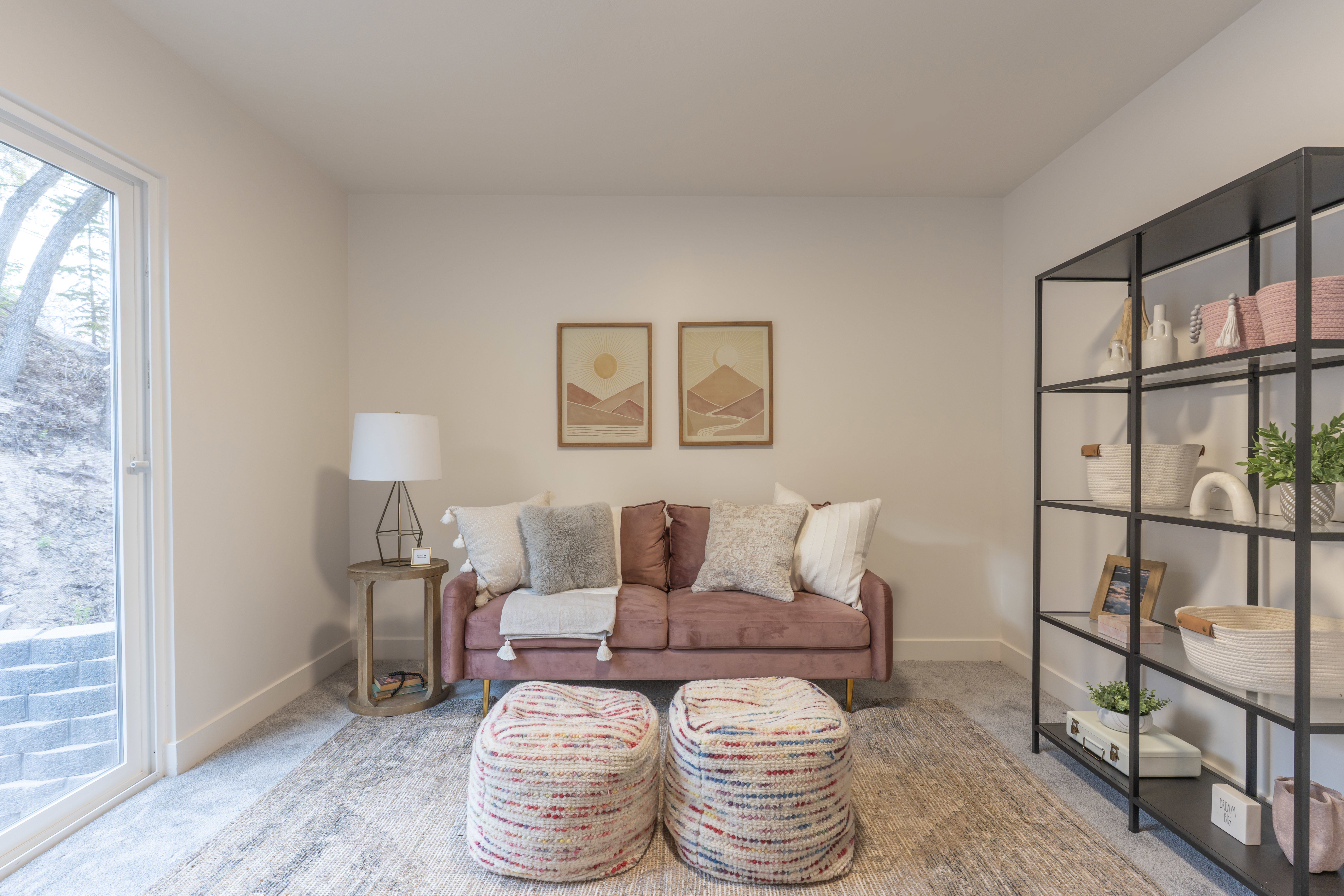 Living area with carpet and baseboards