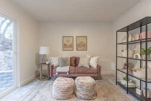 Living area with carpet and baseboards