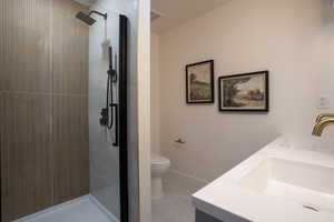 Bathroom with double vanity and a stall shower