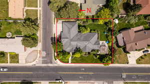 Aerial perspective of suburban area featuring property boundaries highlighted