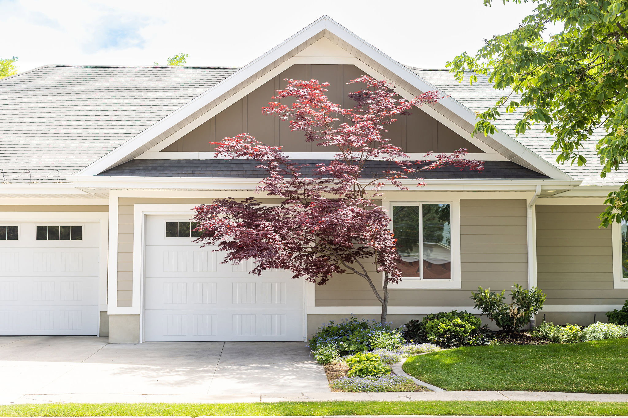 Side of home and garage/driveway
