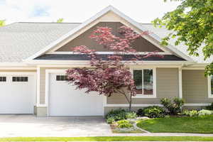 Side of home and garage/driveway