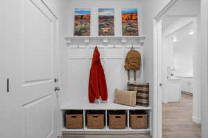 Mudroom with light wood-style floors and recessed lighting