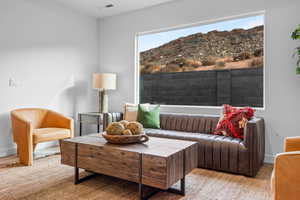 Living area with a mountain view and wood finished floors