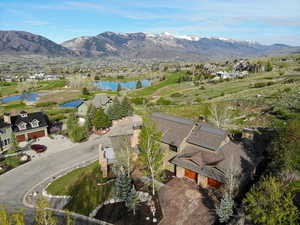 Aerial perspective of suburban area featuring a water and mountain view