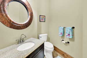Bathroom featuring vanity and toilet