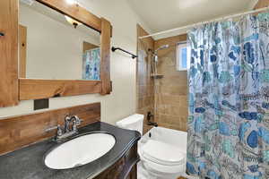 Bathroom with vanity and shower / bath combo