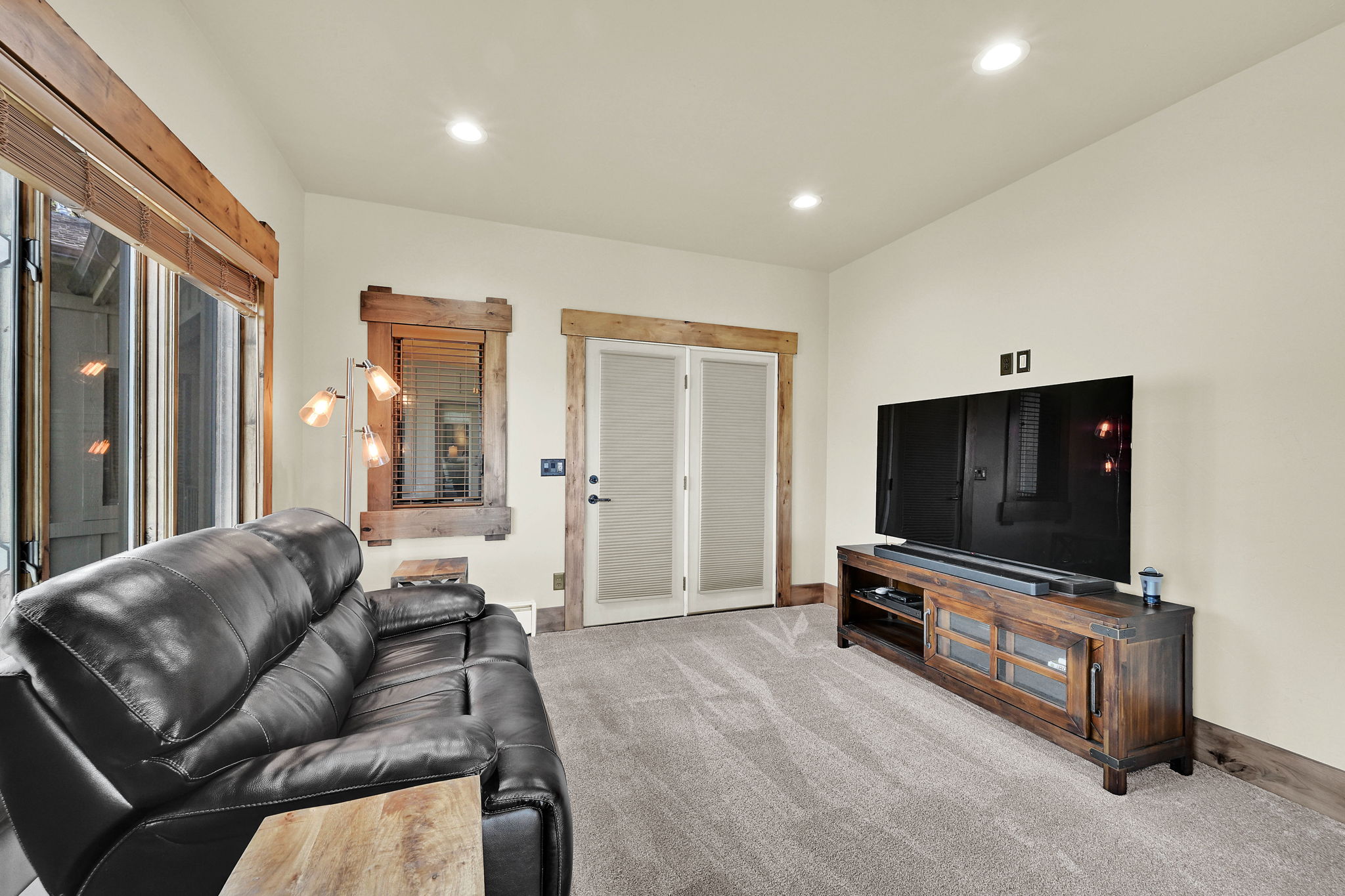 Living area featuring recessed lighting and light colored carpet