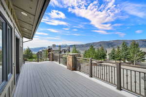 Wooden deck featuring a mountain view