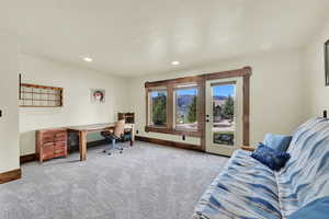 Office with light colored carpet, recessed lighting, and a mountain view